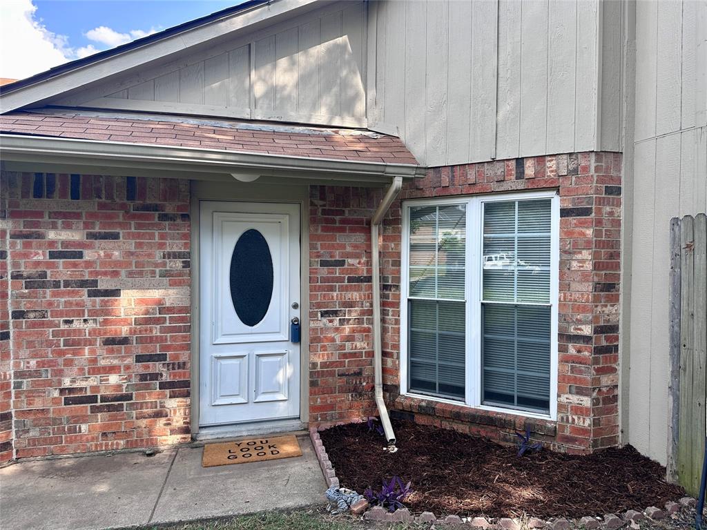 116 Main Place Euless, TX 76040 - Photo 2 of 31 a front view of a building with a garden