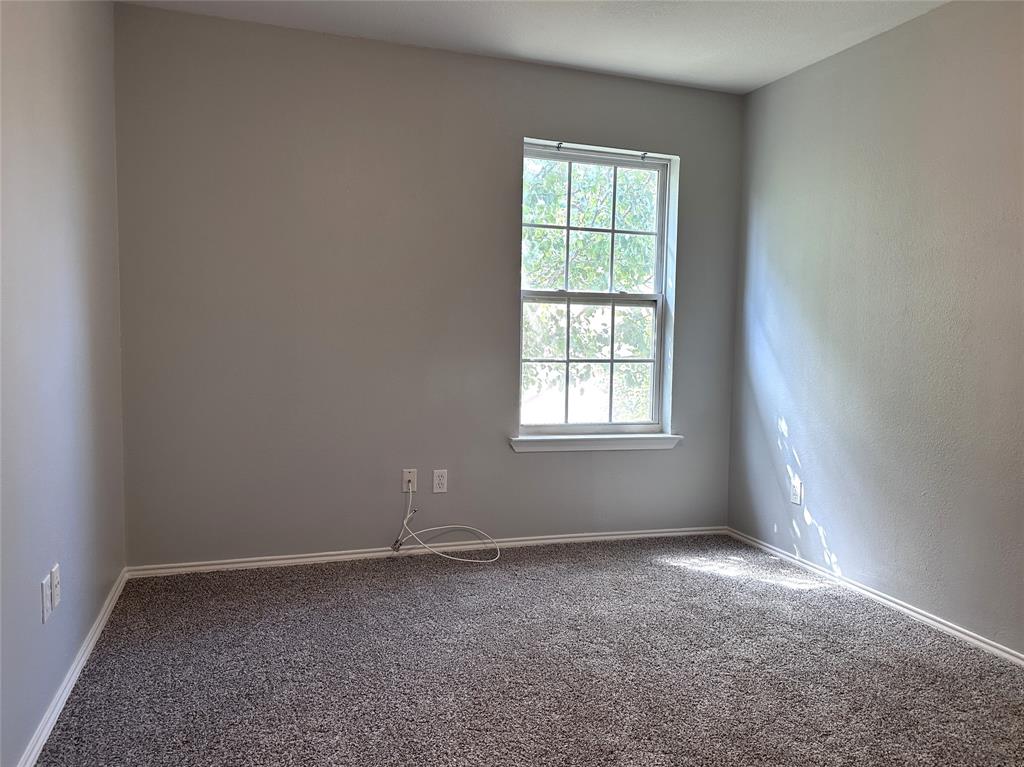 116 Main Place Euless, TX 76040 - Photo 22 of 31 an empty room with a window