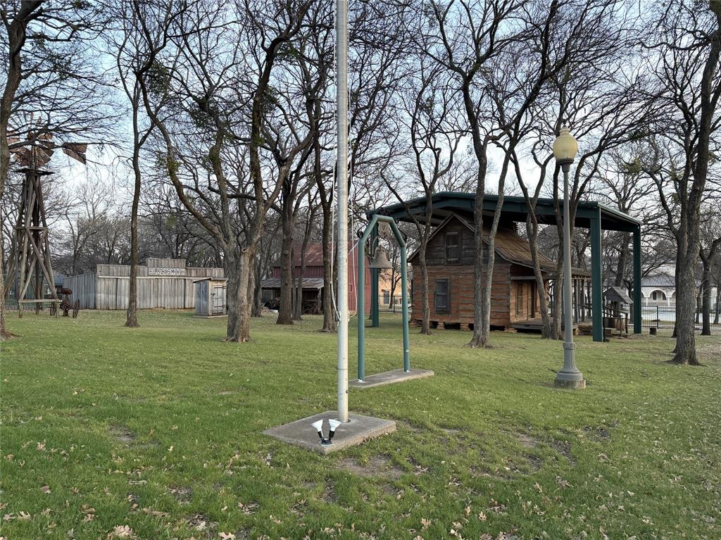 116 Main Place Euless, TX 76040 - Photo 29 of 31 a backyard of a house with lots of green space and fountain