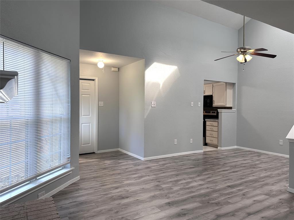 116 Main Place Euless, TX 76040 - Photo 7 of 31 a view of empty room with wooden floor