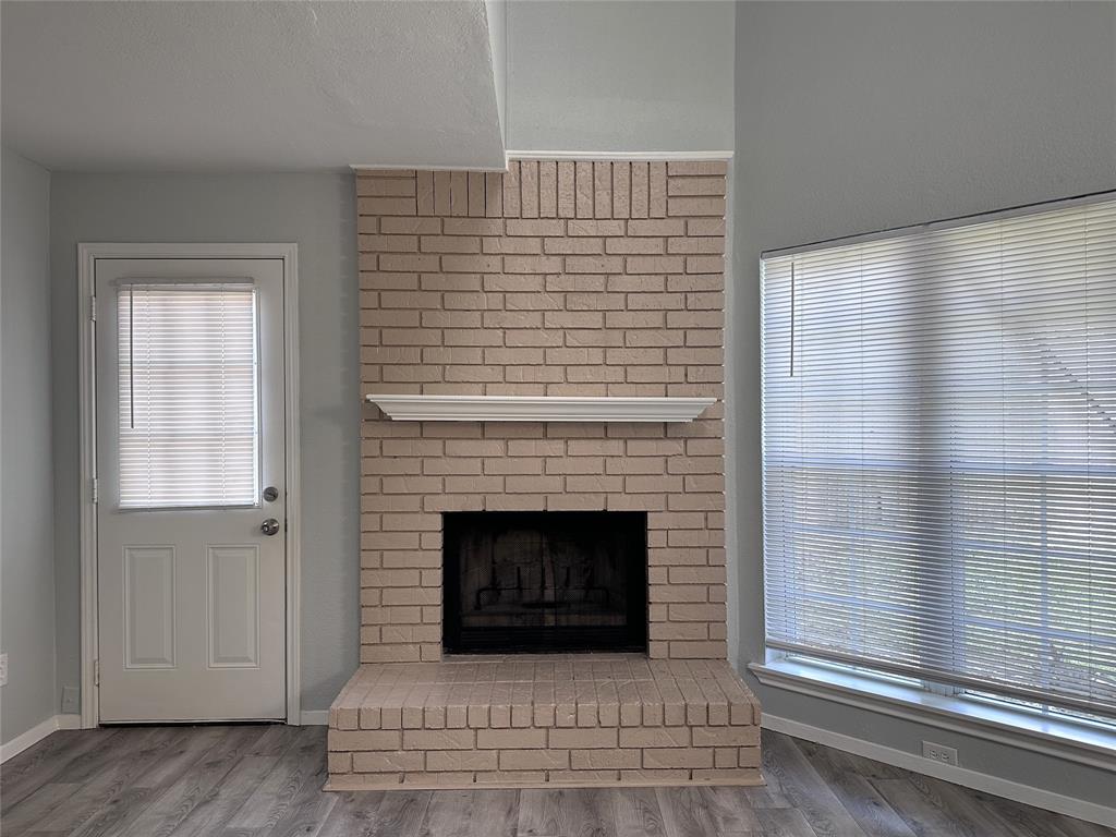 116 Main Place Euless, TX 76040 - Photo 9 of 31 a living room with a fireplace