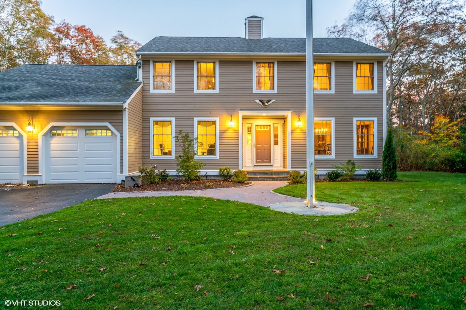 a front view of a house with a yard
