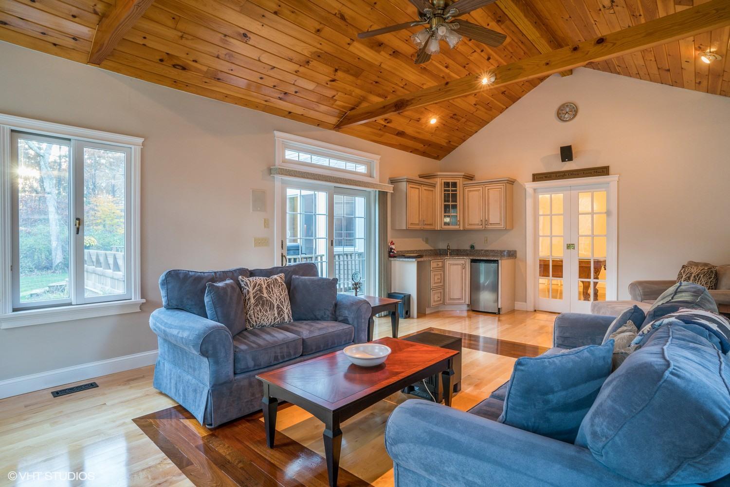 72 John Ewer Road Sandwich, MA 02563 - Photo 12 of 20 a living room with fireplace furniture and a large window