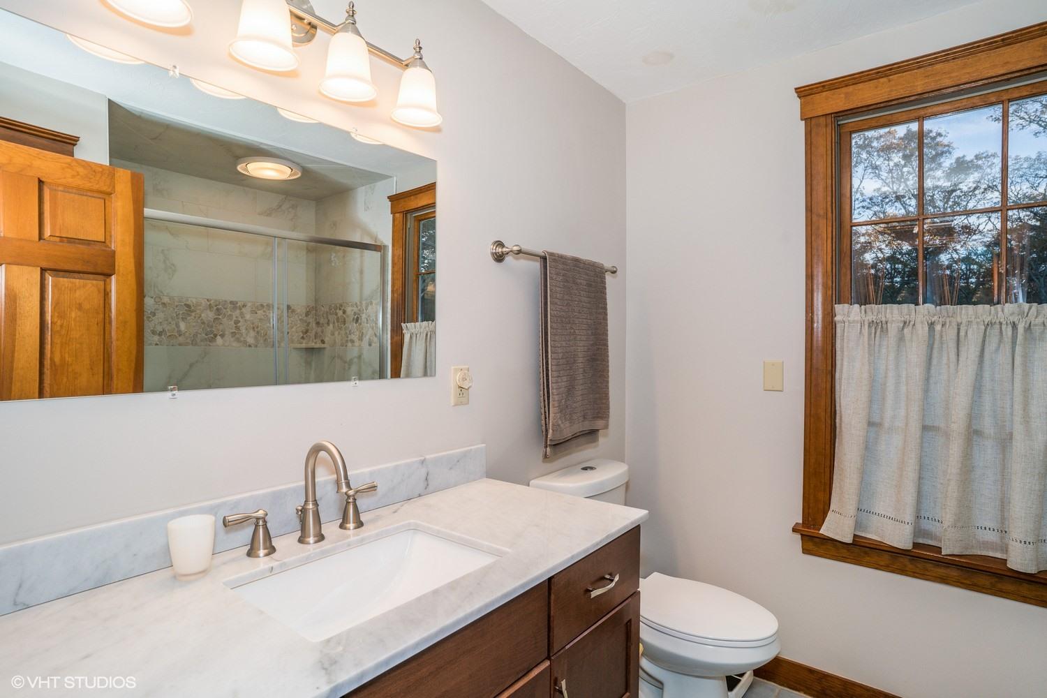 72 John Ewer Road Sandwich, MA 02563 - Photo 16 of 20 a bathroom with a toilet sink and mirror
