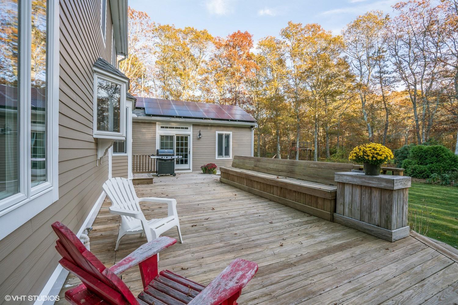 72 John Ewer Road Sandwich, MA 02563 - Photo 17 of 20 a view of house with backyard outdoor seating and wooden floor