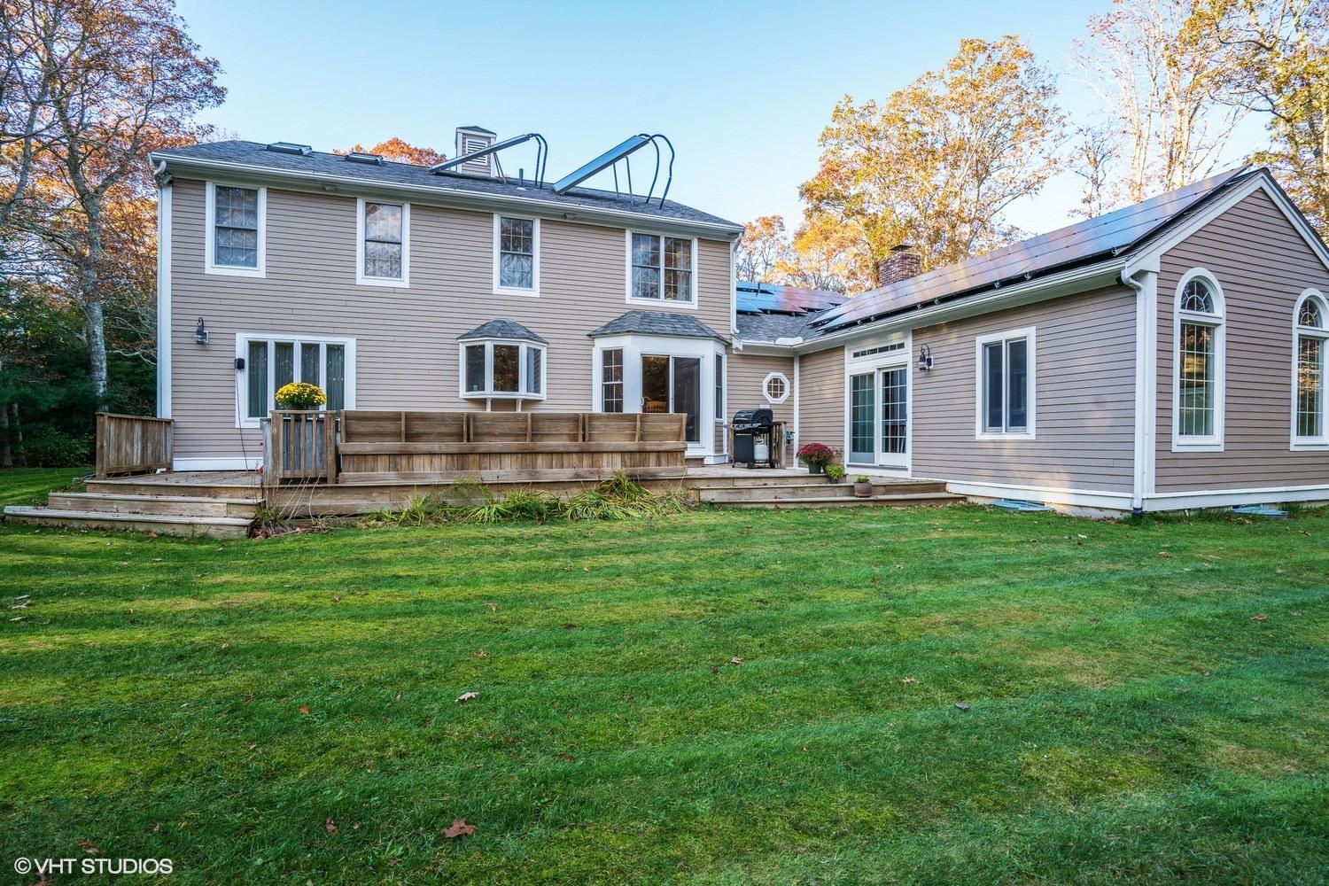 72 John Ewer Road Sandwich, MA 02563 - Photo 19 of 20 a front view of house with yard and green space