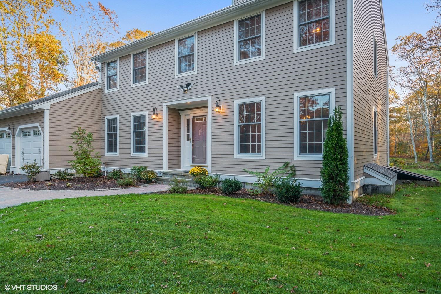 72 John Ewer Road Sandwich, MA 02563 - Photo 20 of 20 a front view of a house with garden and porch
