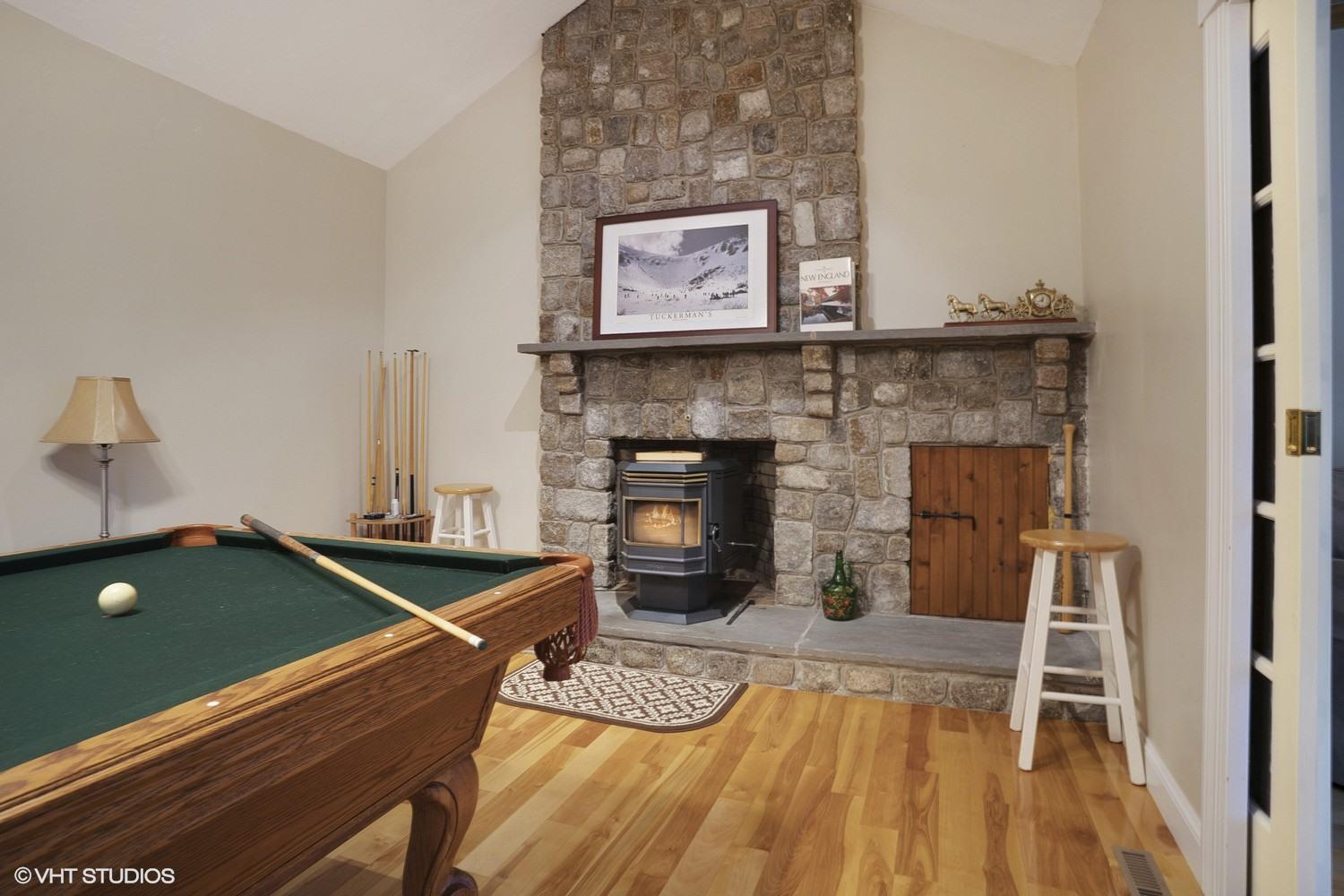 72 John Ewer Road Sandwich, MA 02563 - Photo 10 of 20 a living room with furniture and a fireplace