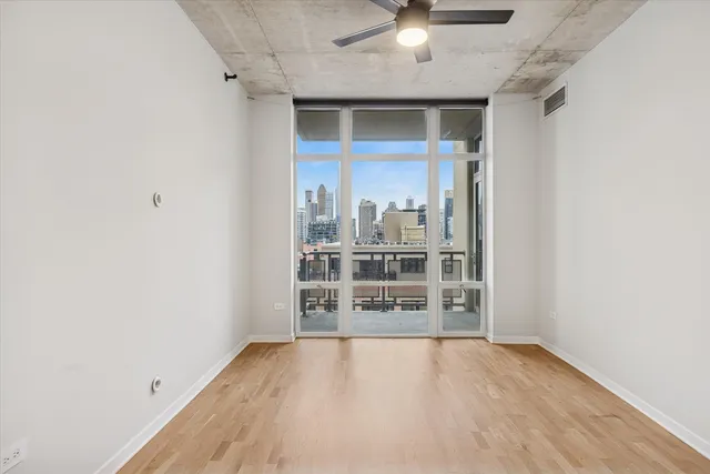 a bathroom with a granite countertop sink mirror and shower