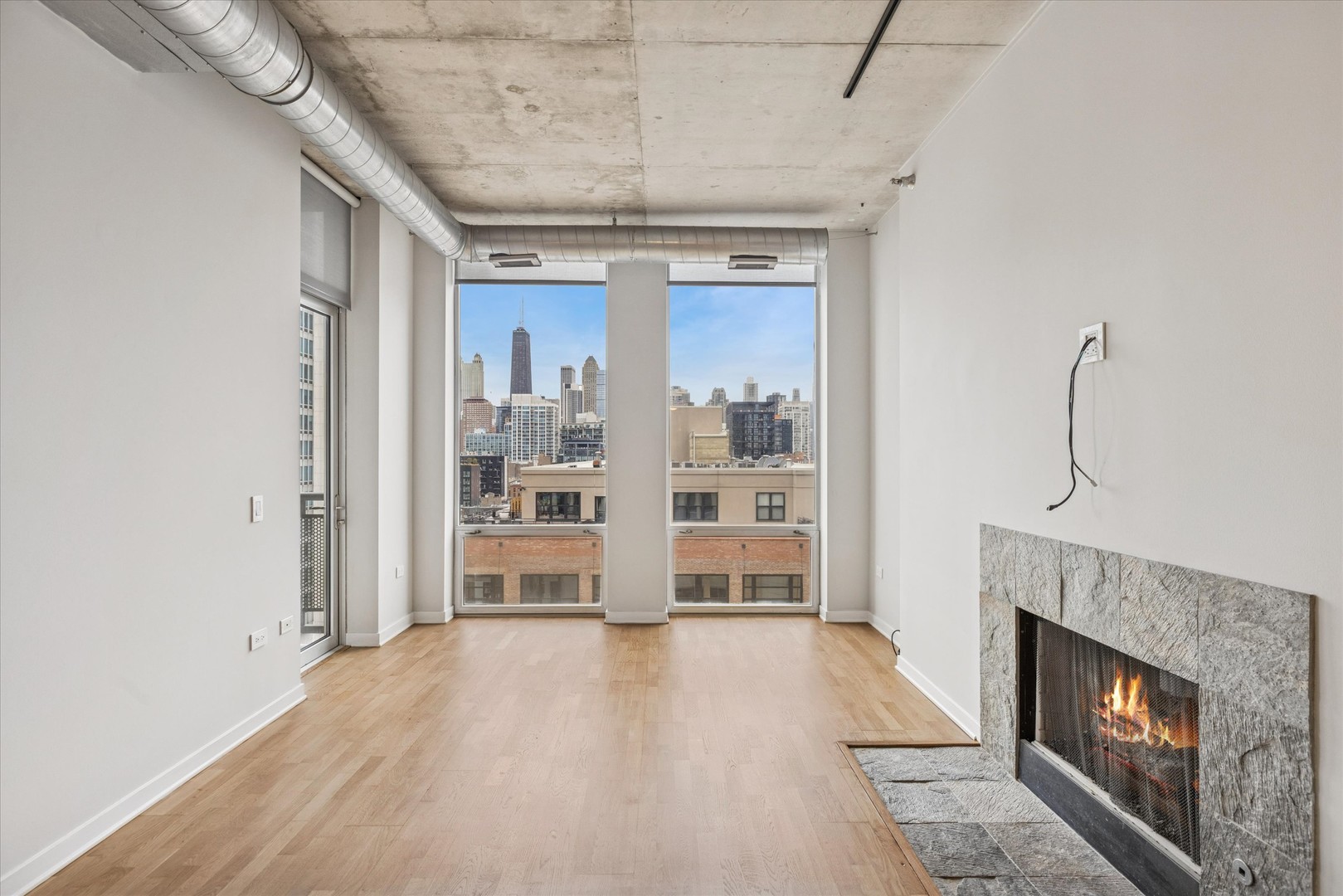 720 North Larrabee Street, Unit 1002 Chicago, IL 60654 - Photo 4 of 20 a view of livingroom with furniture and fireplace