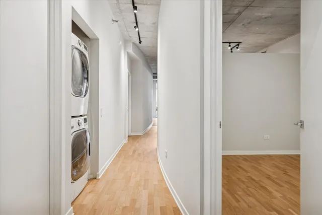 a bathroom with a granite countertop toilet sink and mirror