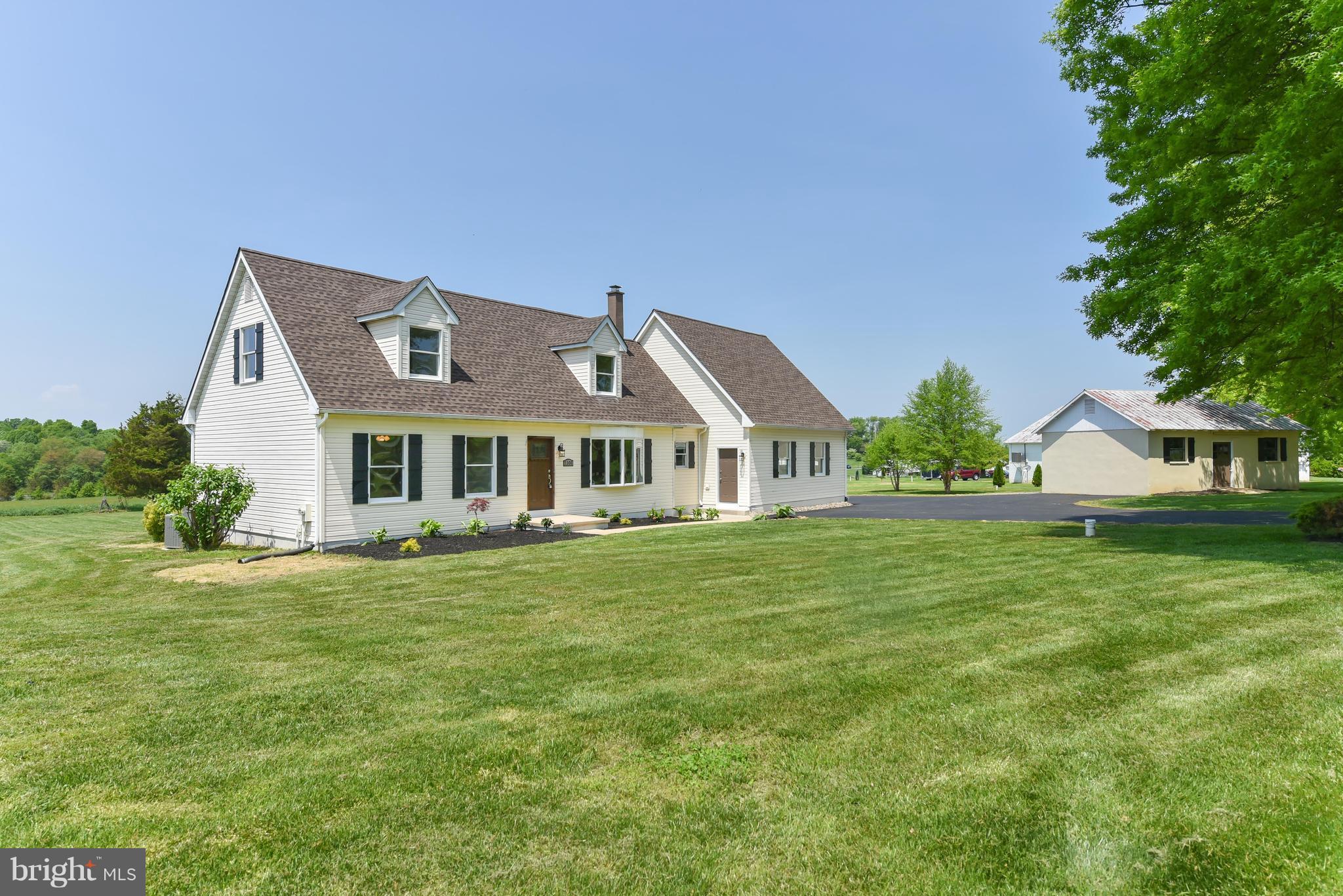 1101 Lombard Road Rising Sun, MD 21911 - Photo 1 of 26 a front view of a house with a garden