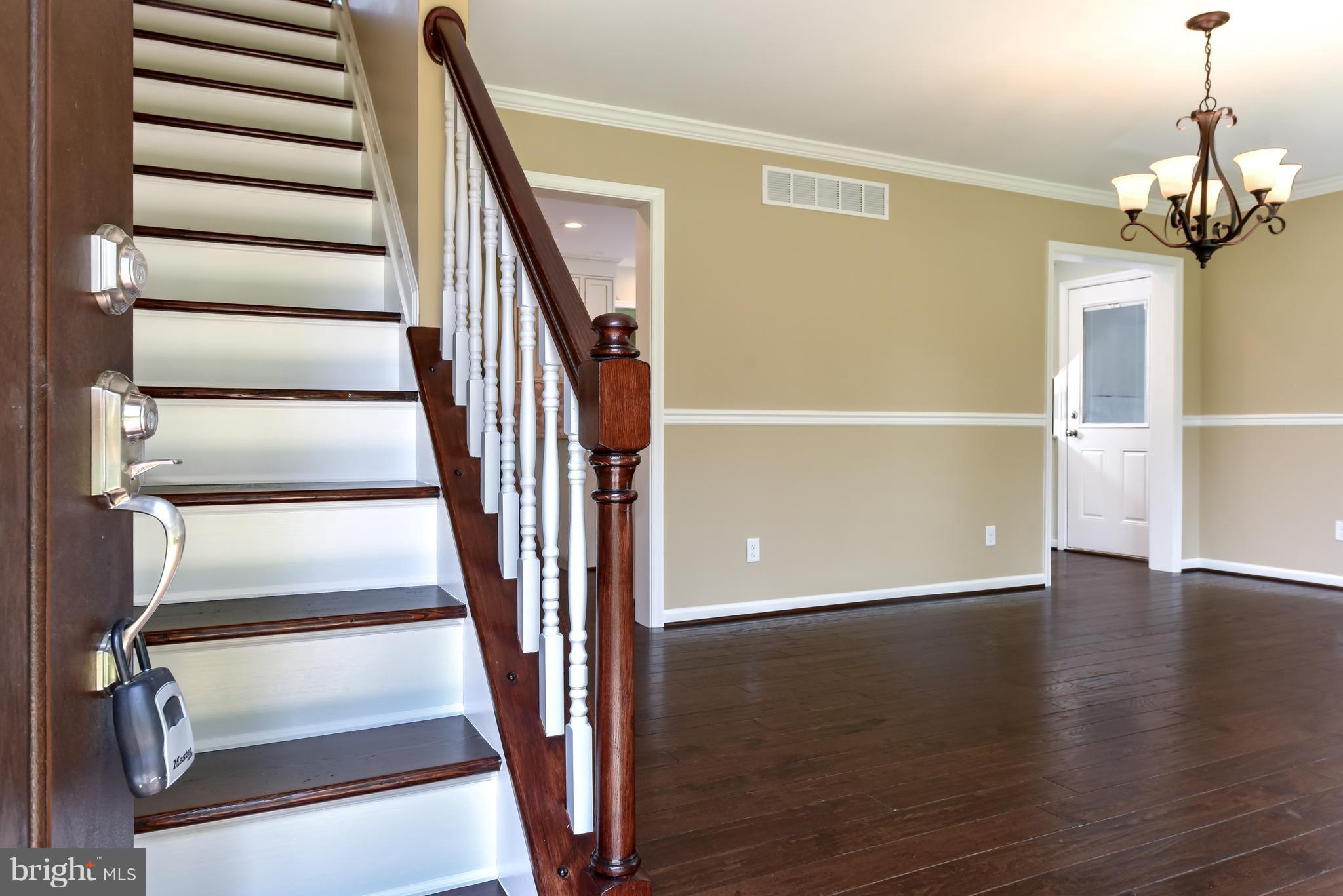 1101 Lombard Road Rising Sun, MD 21911 - Photo 2 of 26 a view of staircase with wooden floor and white walls