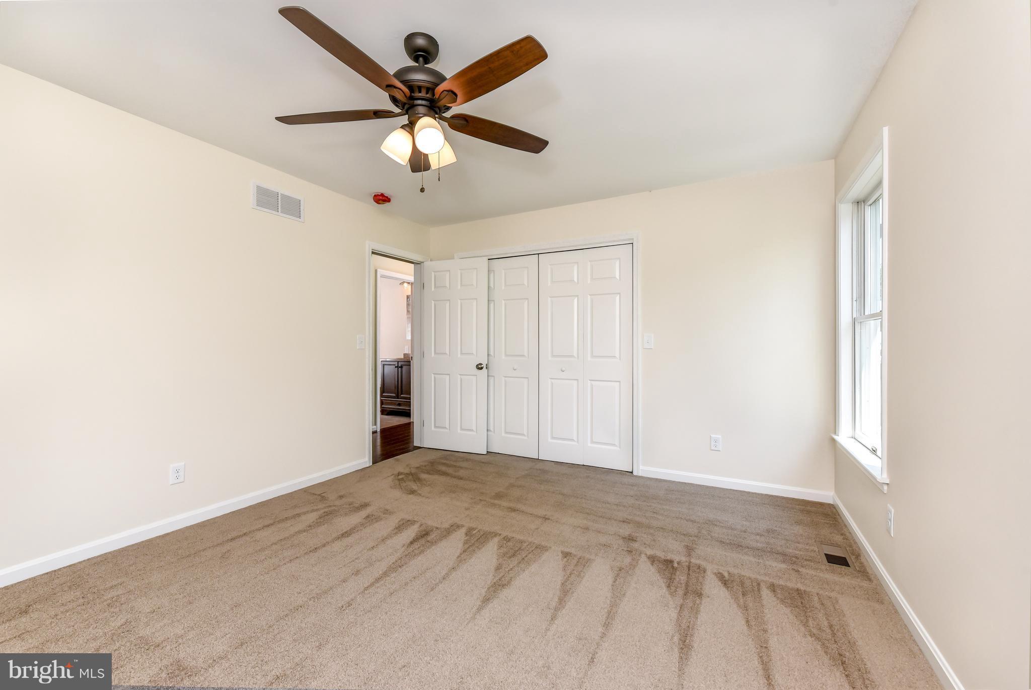1101 Lombard Road Rising Sun, MD 21911 - Photo 11 of 26 a view of a big room with wooden floor and a ceiling fan