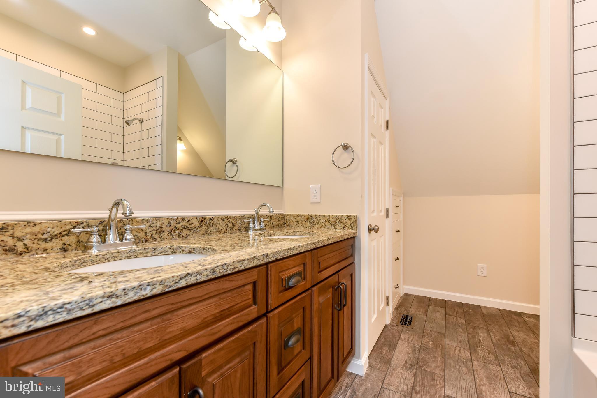 1101 Lombard Road Rising Sun, MD 21911 - Photo 19 of 26 a bathroom with a granite countertop sink and a mirror