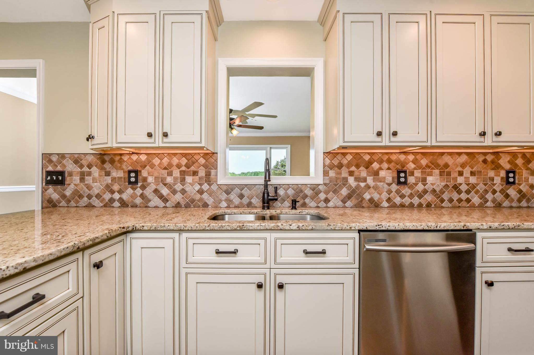 1101 Lombard Road Rising Sun, MD 21911 - Photo 5 of 26 a kitchen with granite countertop a sink and a window