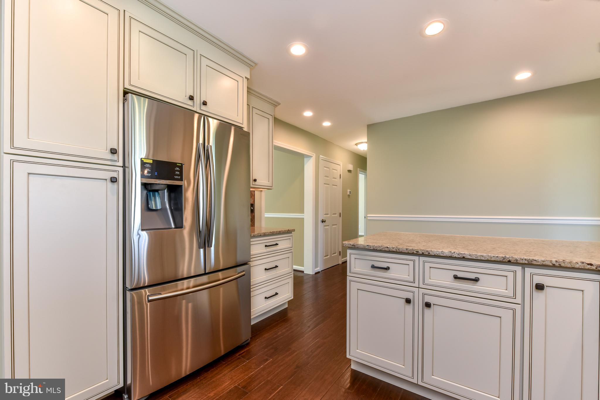 1101 Lombard Road Rising Sun, MD 21911 - Photo 7 of 26 a kitchen with stainless steel appliances a refrigerator sink and cabinets