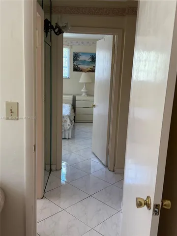 a view of a bathroom from a hallway