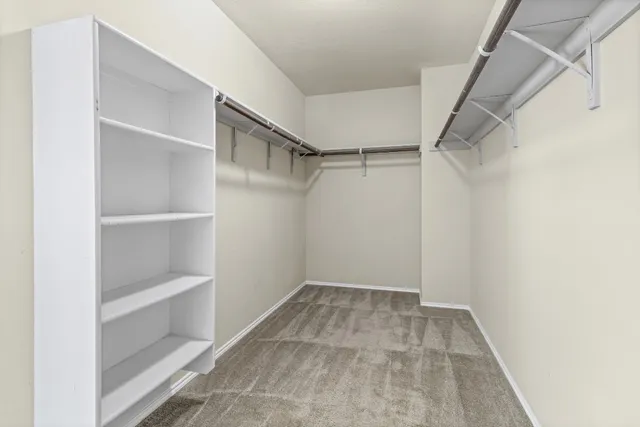 a large kitchen with granite countertop a stove and a sink