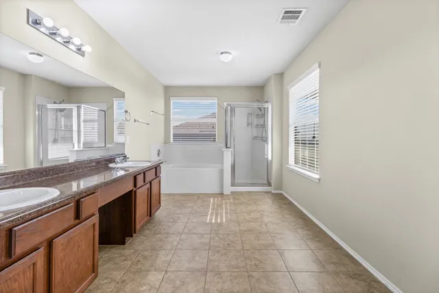 a room with a sink and a stove top oven