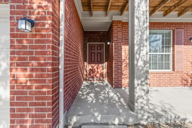 a view of a door and a window