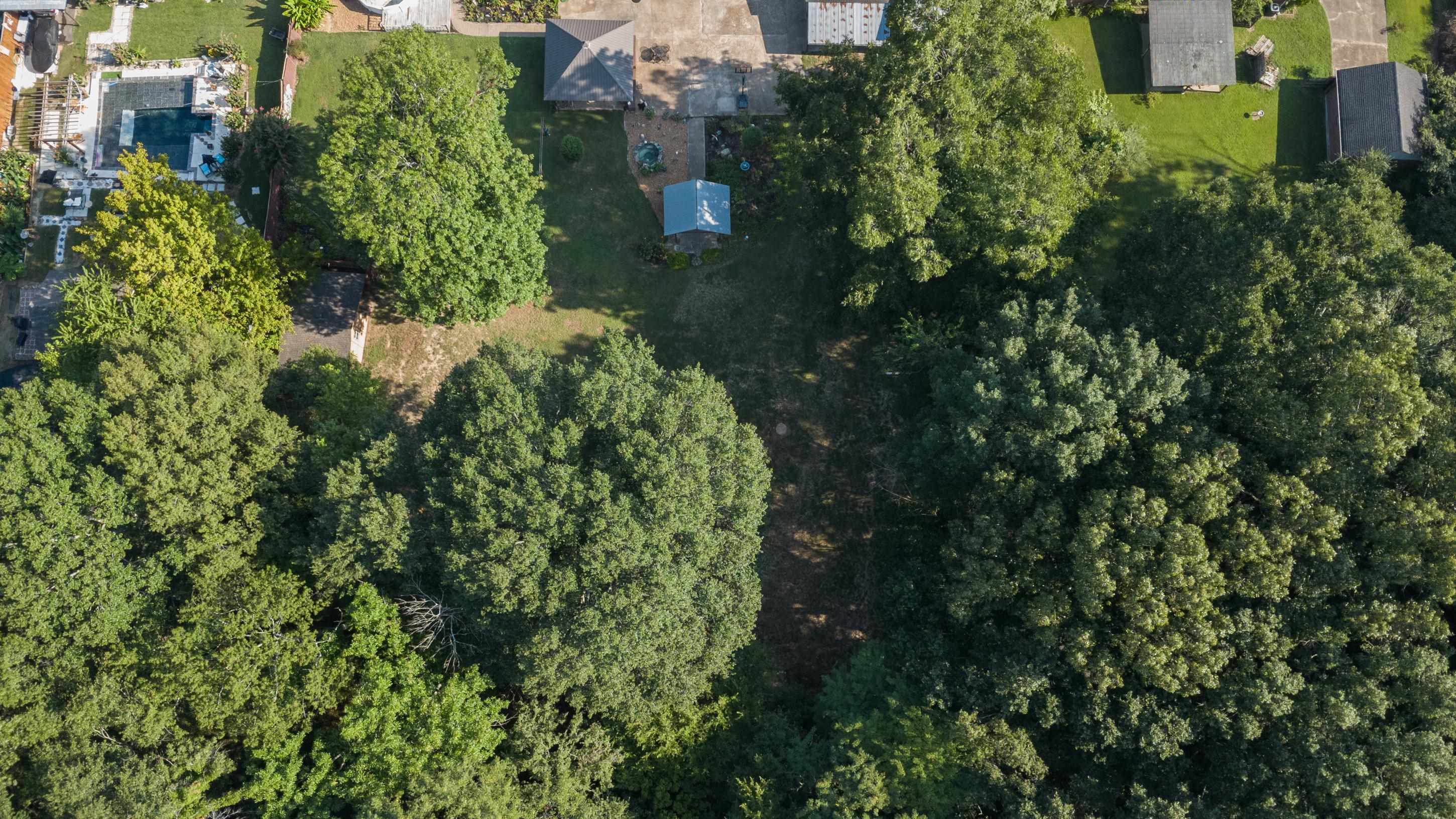 5563 Crestview Road Memphis, TN 38134 - Photo 39 of 40 an aerial view of residential house with outdoor space and trees all around