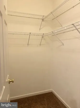 a view of a hallway with chandelier