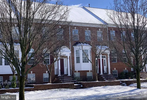 a front view of house with a street