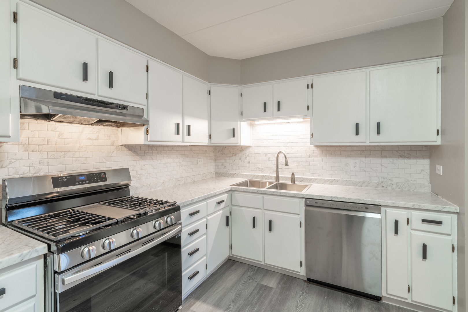 118 East Bailey Road, Unit A Naperville, IL 60565 - Photo 6 of 15 a kitchen with cabinets appliances and a sink