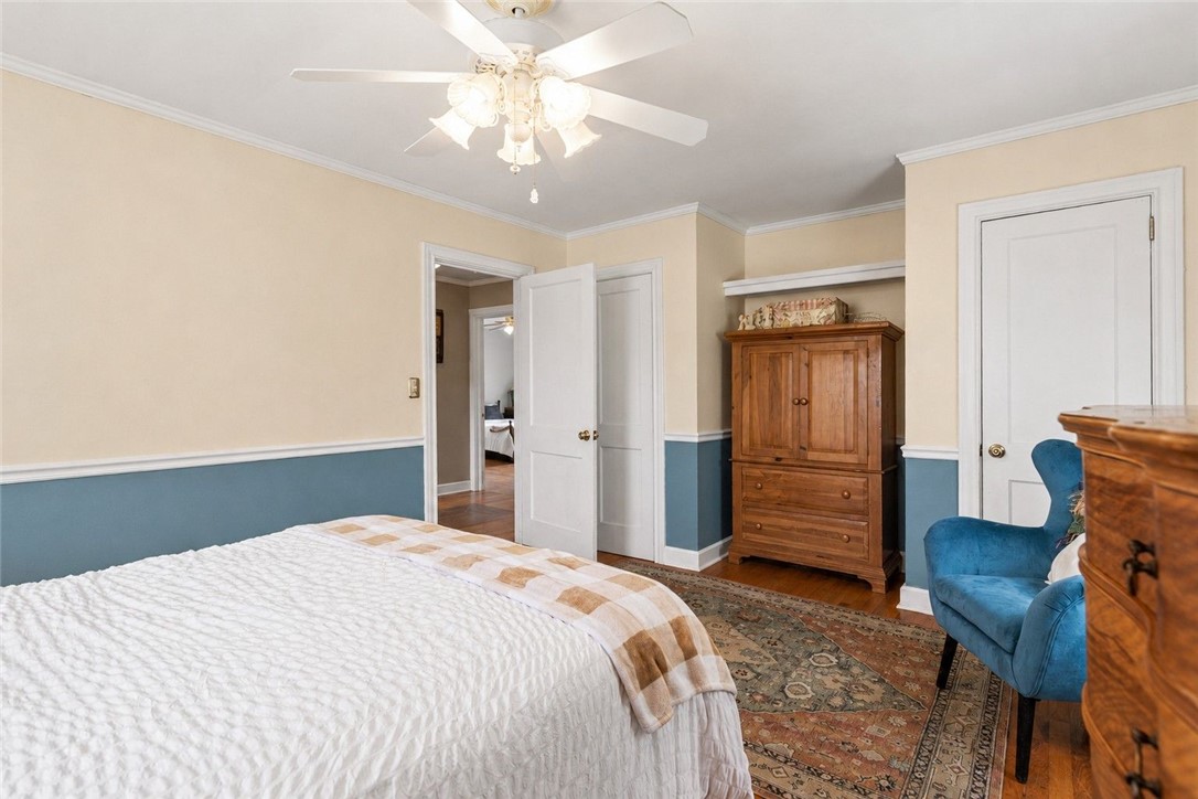 26 Oak Dr Extension Honea Path, SC 29654 - Photo 22 of 31 Polished hardwood floors and classic chair rail molding define this peaceful sleeping space.