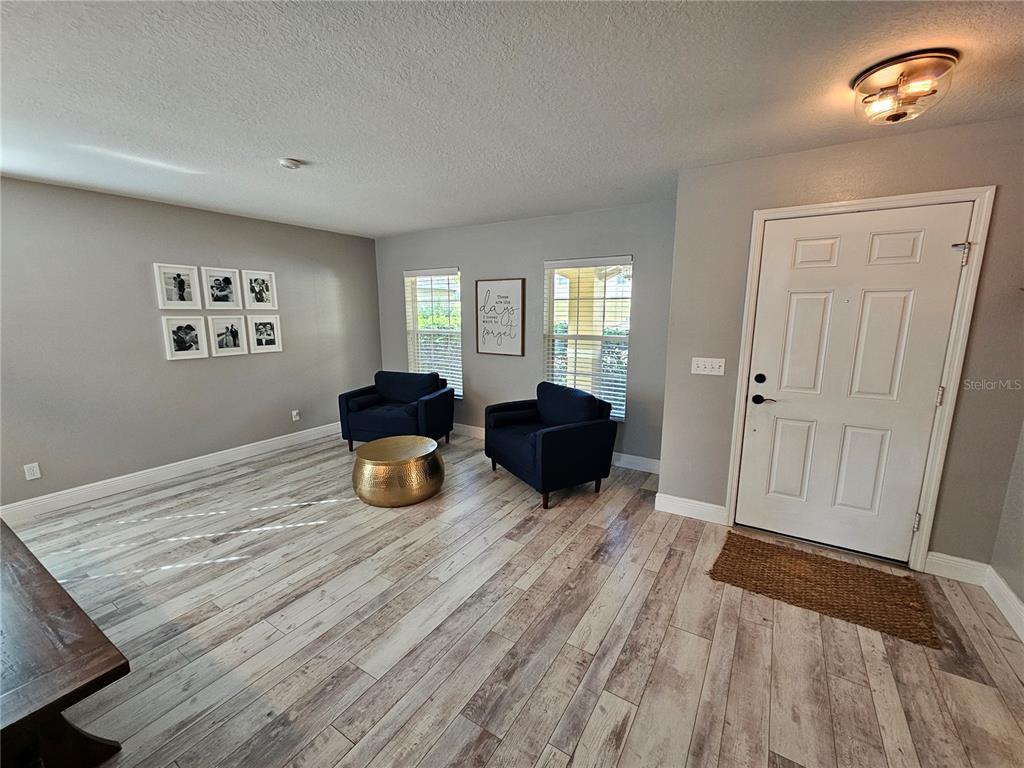 20946 Sullivan Ranch Boulevard Mount Dora, FL 32757 - Photo 4 of 26 a bed room with furniture and window