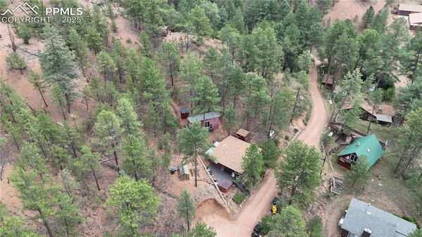 an aerial view of residential house with outdoor space