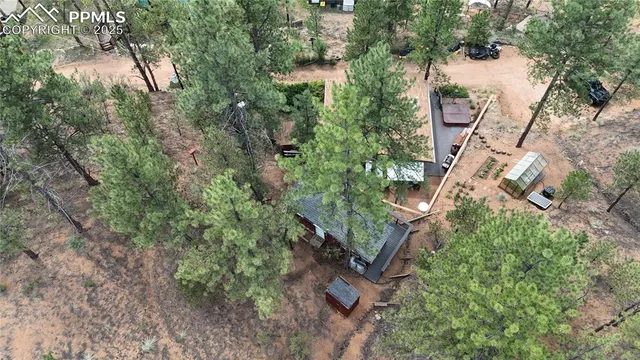 an aerial view of a house with outdoor space