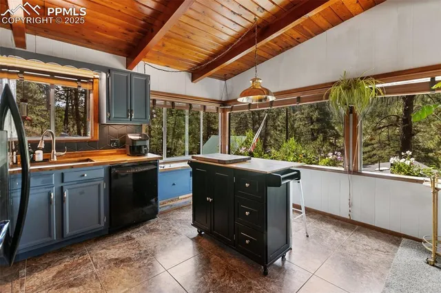 a kitchen with a sink and wooden cabinets
