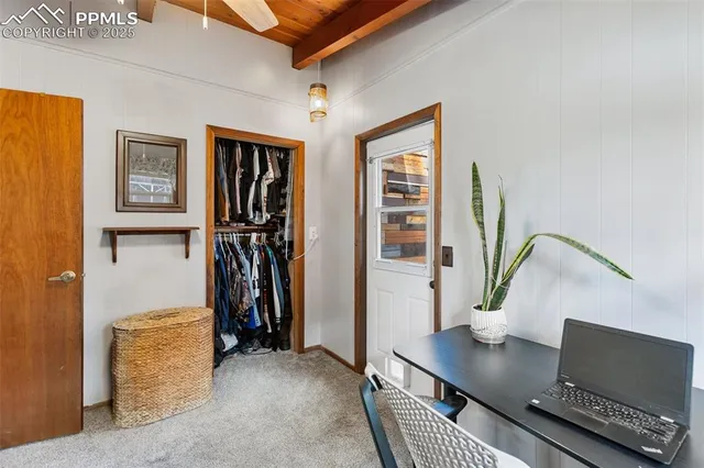 a view of a backyard with sitting area