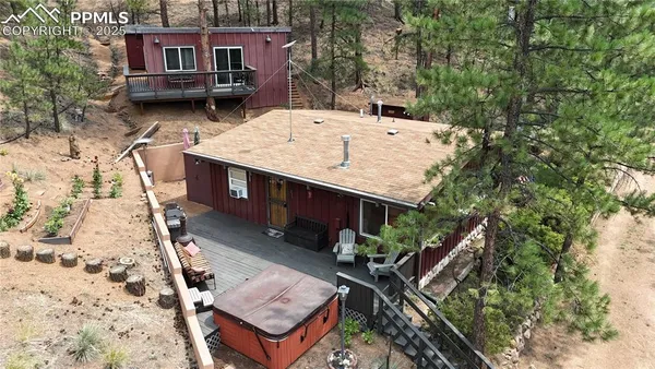an aerial view of a house with a yard