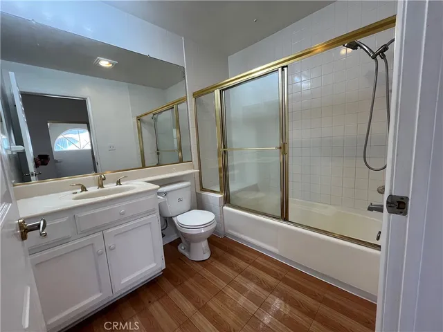 a bathroom with a toilet sink and shower