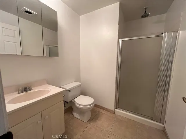 a bathroom with a sink toilet and vanity