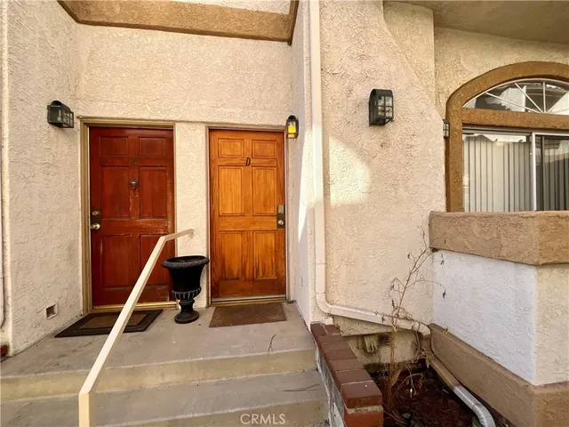 a view of a livingroom with furniture and entryway