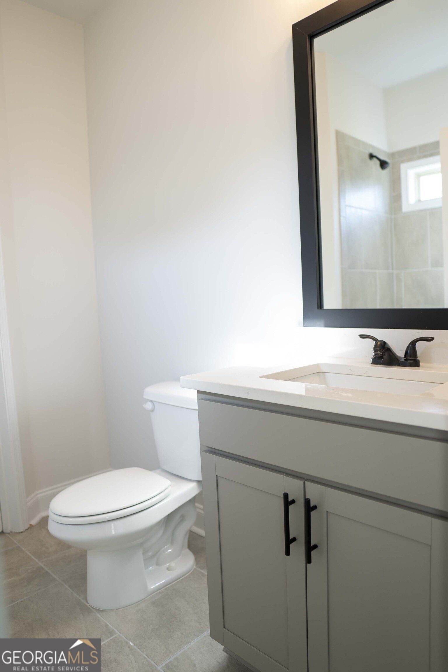 600 Beaver Court Perry, GA 31069 - Photo 23 of 48 a bathroom with a toilet a sink and mirror