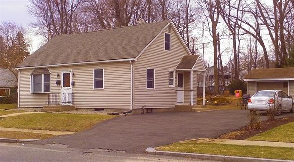 27 Calvin Street Springfield, MA 01104 - Photo 1 of 14 a view of a house with a patio