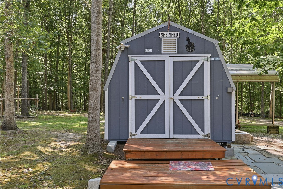 967 Ampthill Road Cartersville, VA 23027 - Photo 10 of 43 Gambrel roof shed with double barn doors, a wood-f