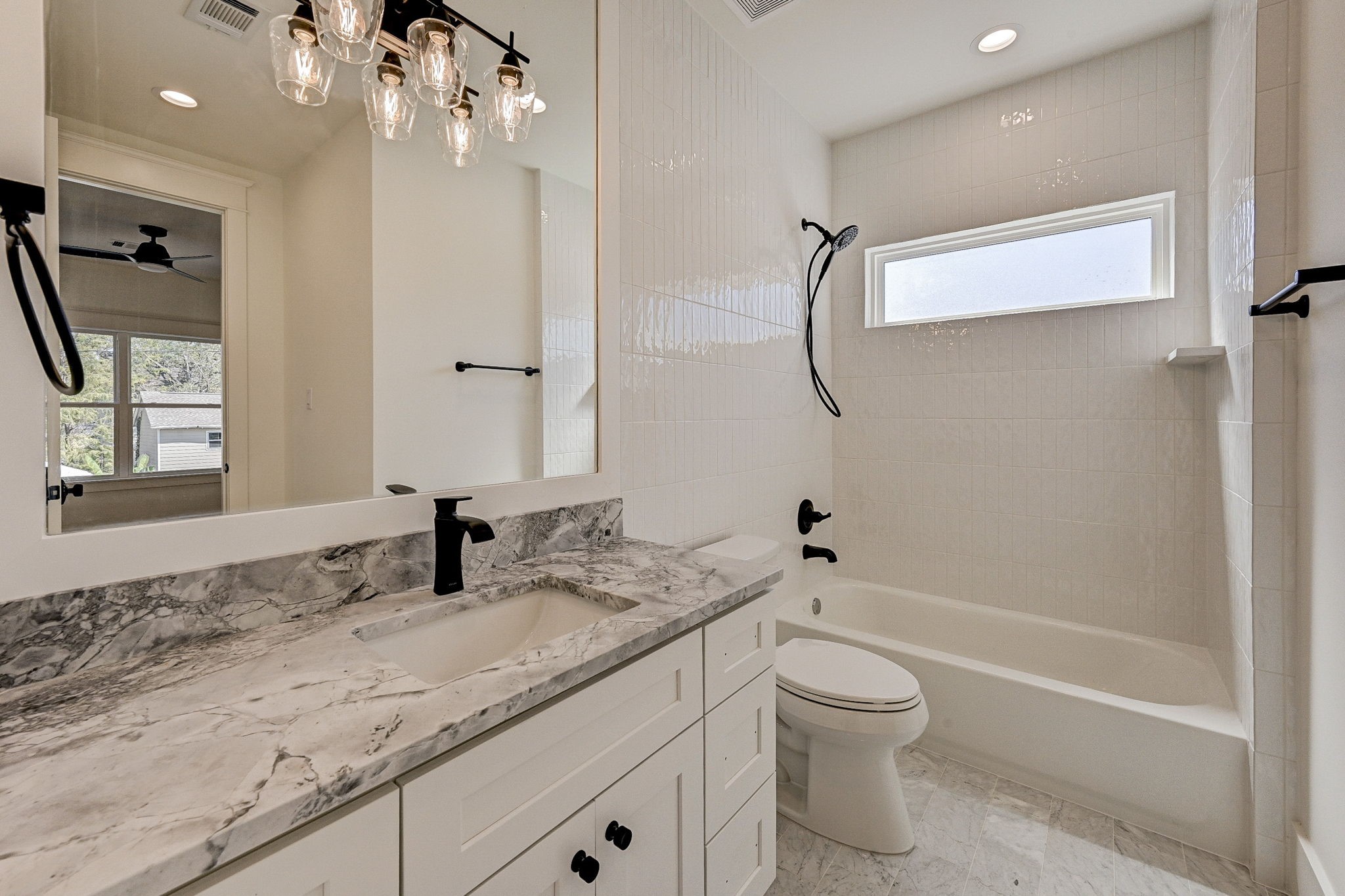 1520 Nicholson Street Houston, TX 77008 - Photo 32 of 39 a bathroom with a granite countertop sink a toilet and shower