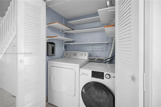 a view of a lake with a house in the background