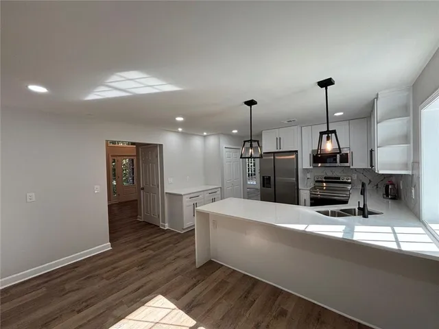 a view of a livingroom with stairs
