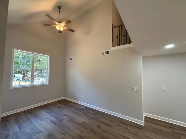 a view of a backyard with large trees
