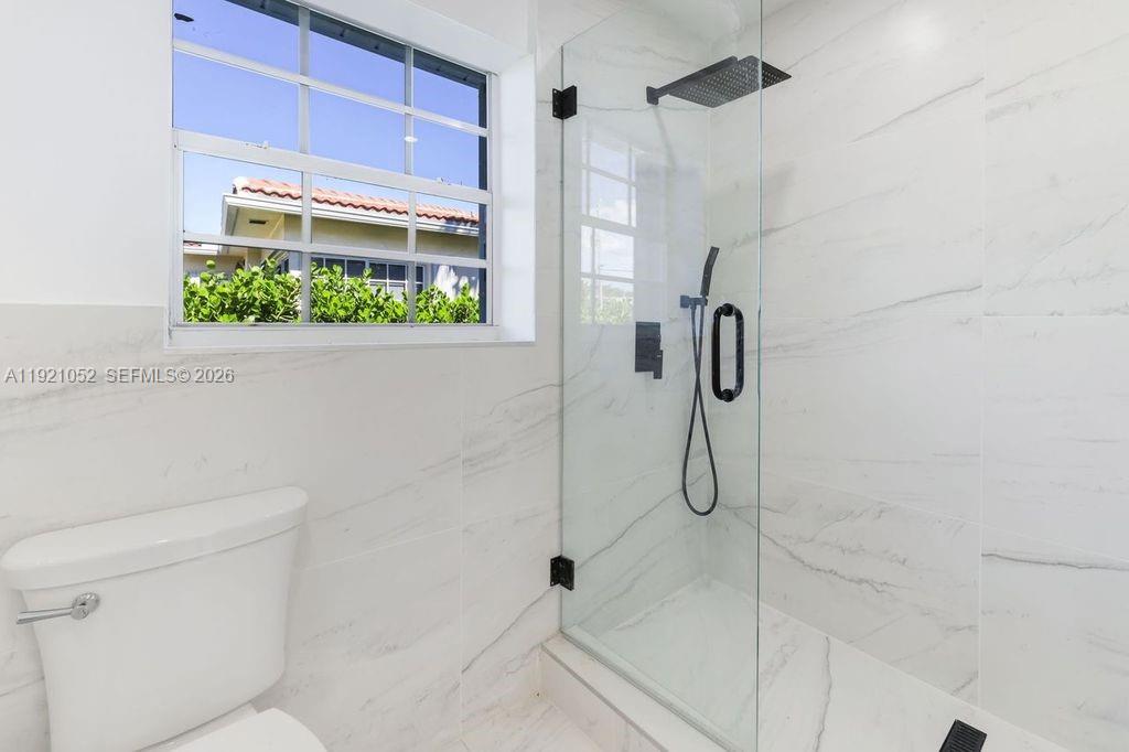 725 91st Street Surfside, FL 33154 - Photo 15 of 32 a bathroom with a shower