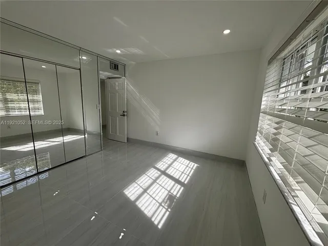 a view of an empty room and window