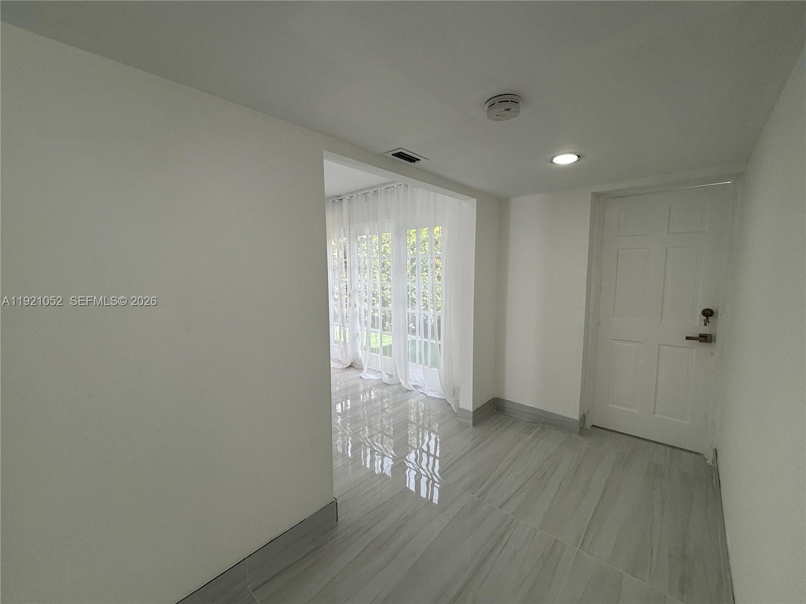 725 91st Street Surfside, FL 33154 - Photo 24 of 32 a view of entryway with wooden floor