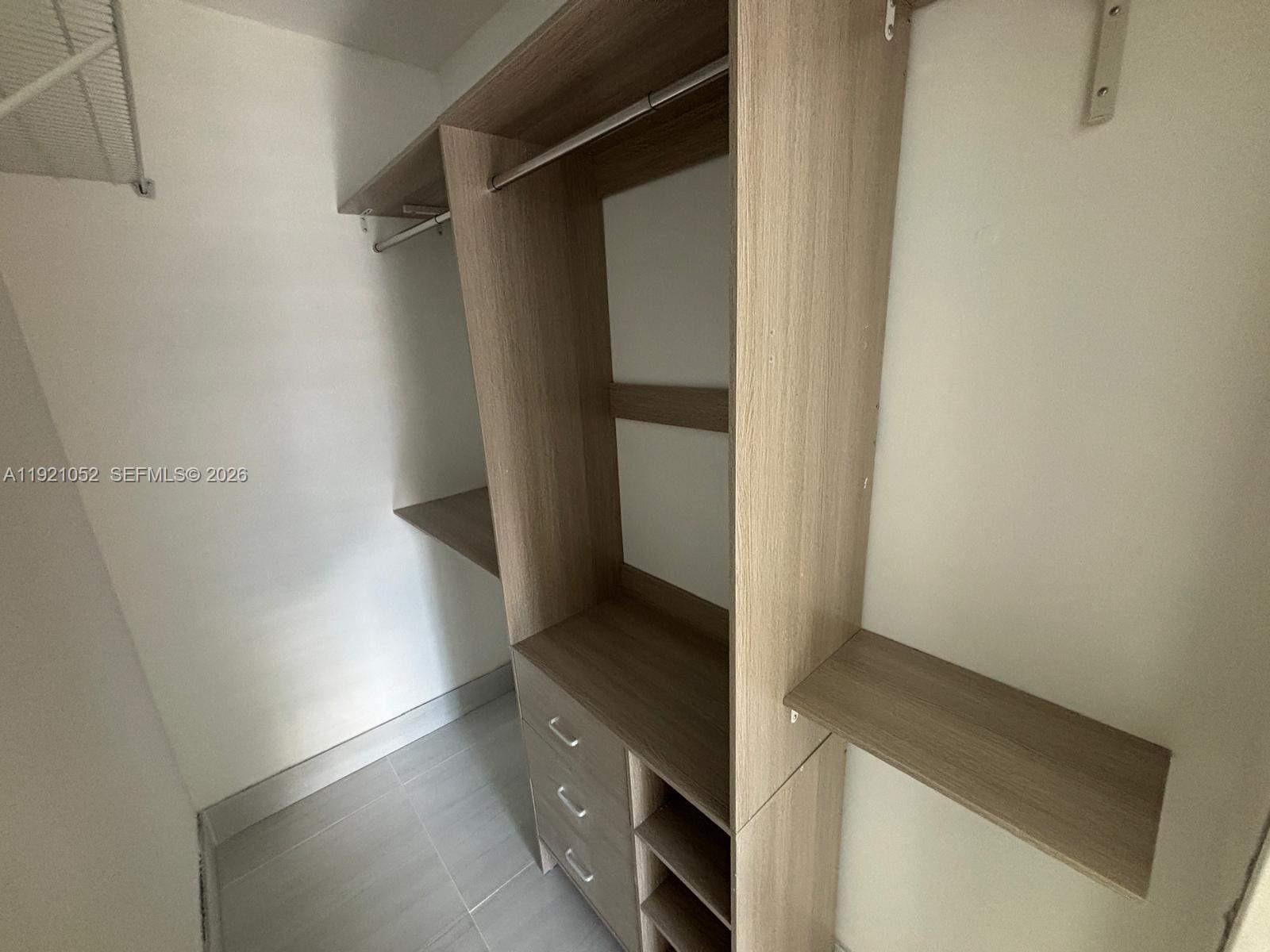 725 91st Street Surfside, FL 33154 - Photo 28 of 32 a view of walk in closet